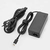 A black universal 65W USB-C laptop charger with a cable and power adapter.