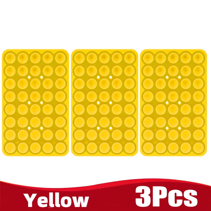 Three yellow silicone suction cup phone holders