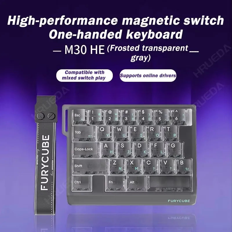 A gray FuryCube magnetic switch one-handed keyboard with frosted transparent keycaps and a detachable cable.