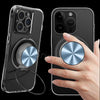 A hand holds a clear magnetic phone ring holder and stand with a universal adapter, showing the device's design.