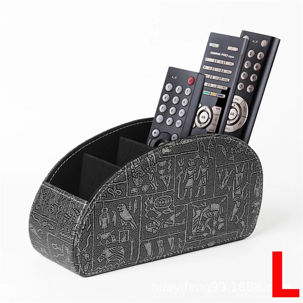 A black PU leather remote control holder with five compartments displaying various electronic devices.
