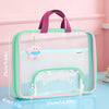 A transparent mesh file bag in mint green and pink with a purple handle, featuring a clear window and a zippered compartment.