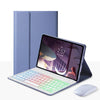A purple backlit keyboard case for an Honor Pad 10 Pro tablet is shown next to its corresponding keyboard and mouse.