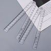 A set of clear acrylic geometry rulers with graduated markings and mounting points.
