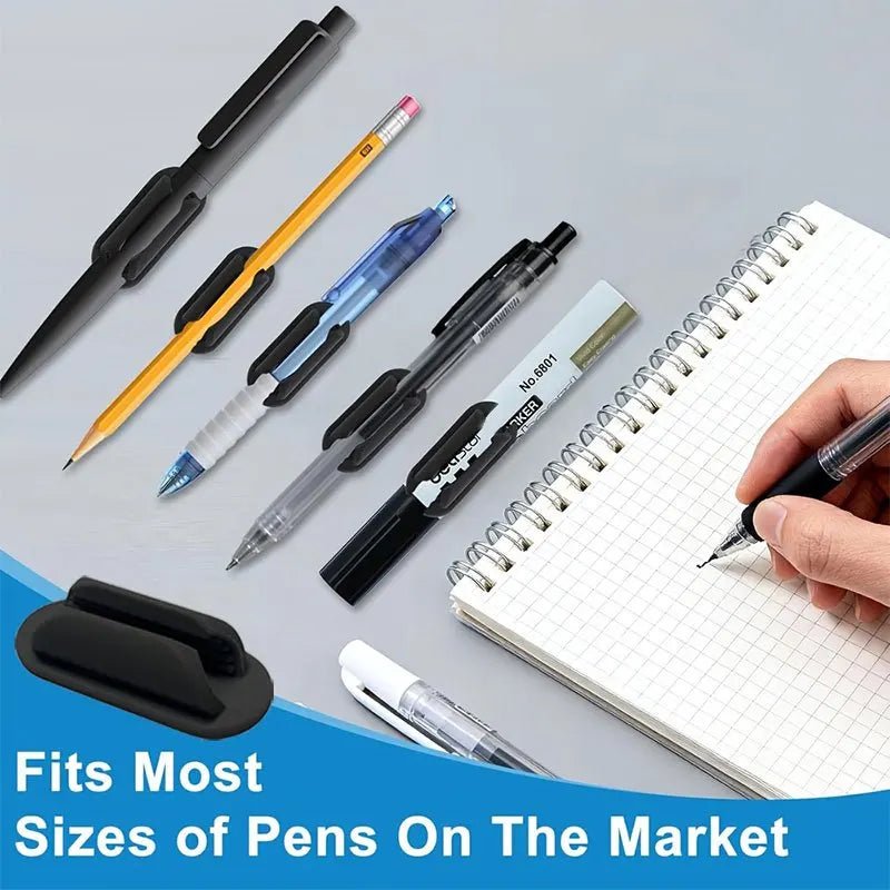 A collection of various pens and a silicone holder are shown on a white notebook.