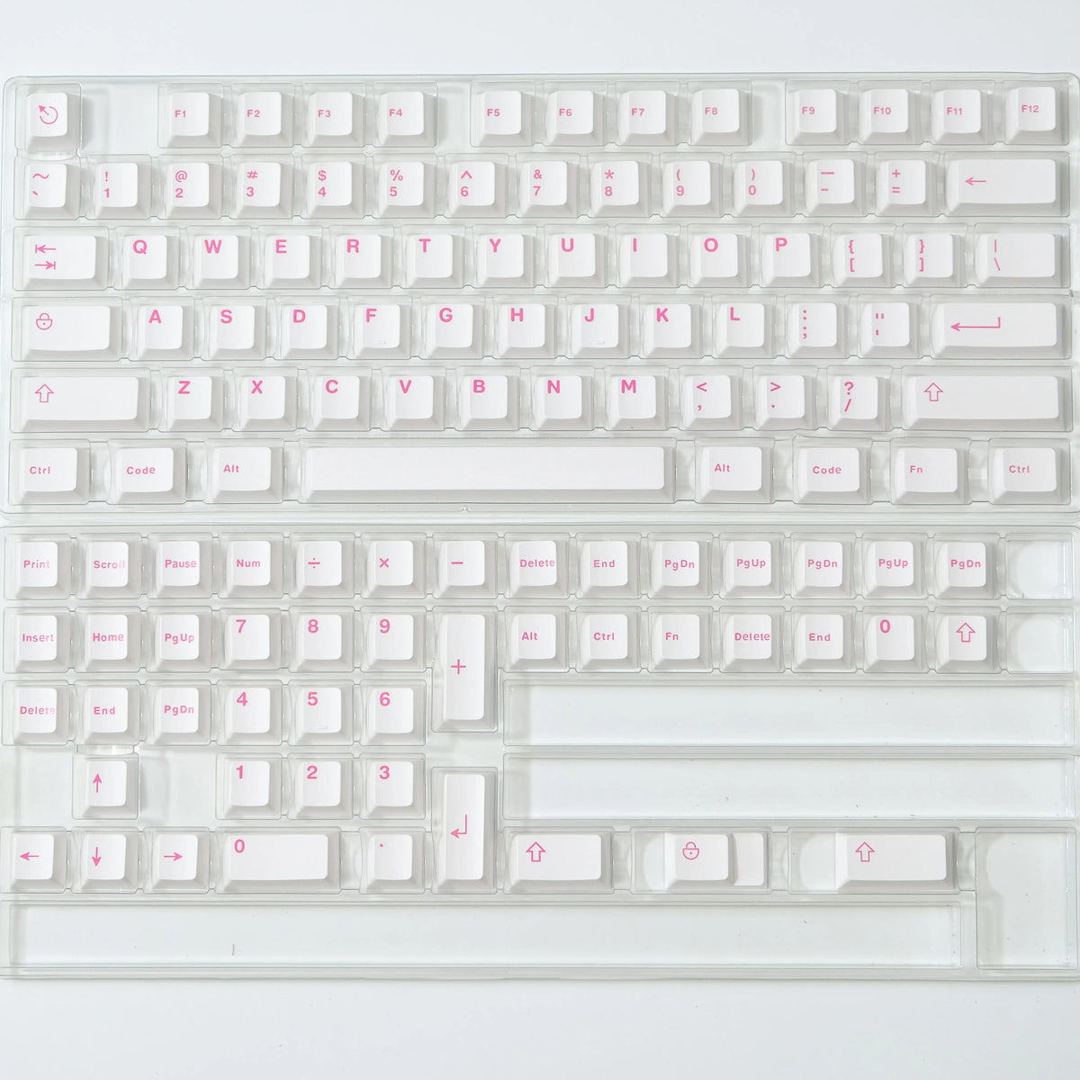A close-up view of a clear acrylic mechanical keyboard featuring dark blue PBT keycaps and cherry profile switches.