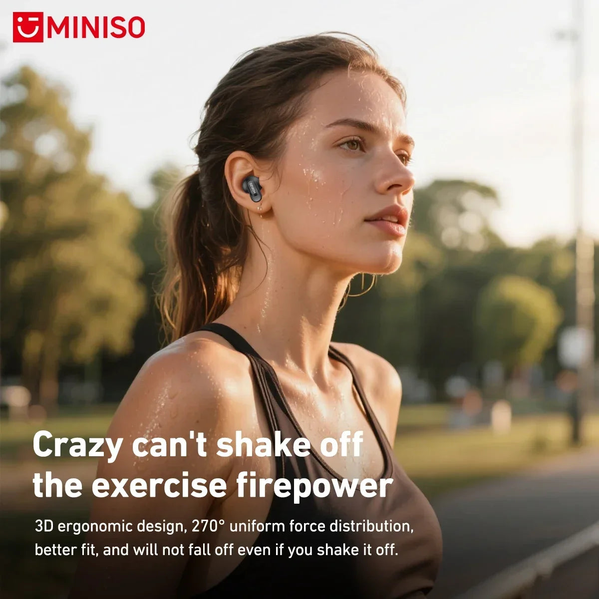 A woman is shown exercising outdoors while wearing Bluetooth earphones with a microphone.