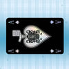 A black card featuring a holographic laser design and various symbols on a light blue striped background.