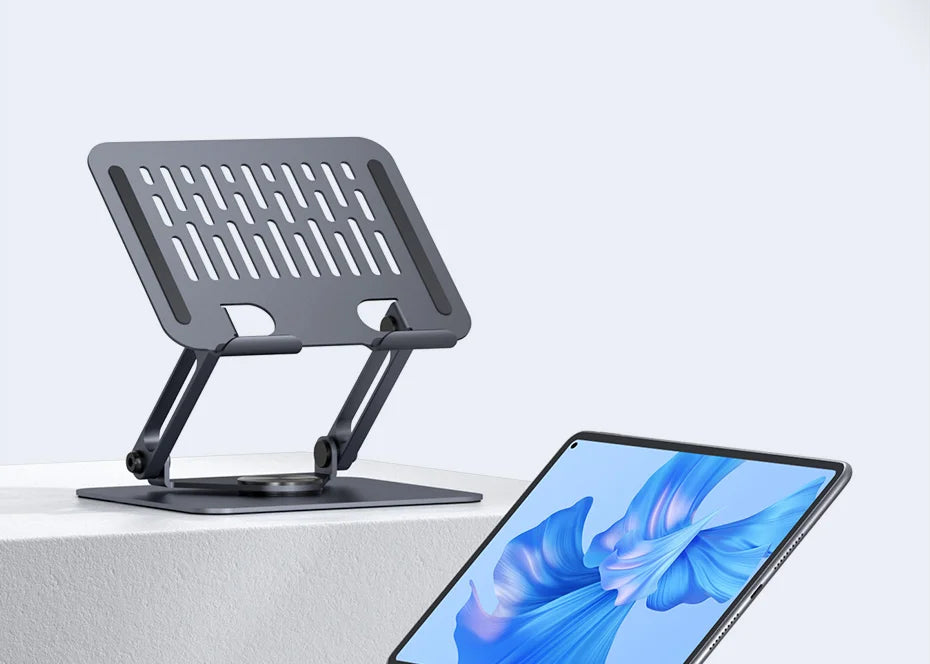 A gray aluminum tablet stand with a slotted design is shown next to a tablet device.