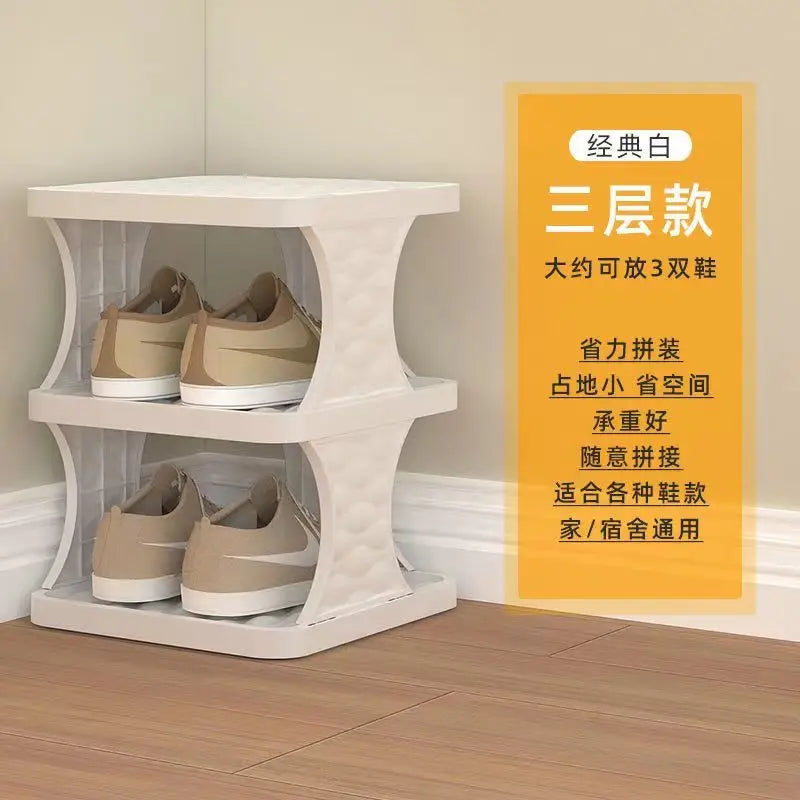 A white plastic tiered shoe rack displaying three pairs of beige shoes.