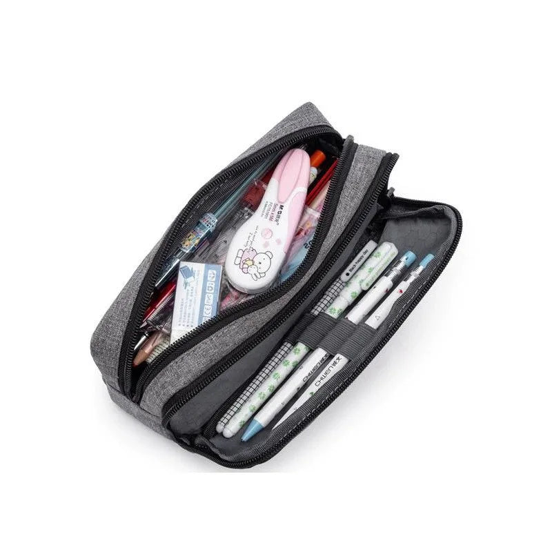 A gray aesthetic Oxford pencil pouch filled with various writing tools and supplies.
