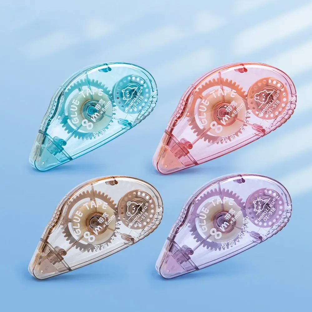 Three clear adhesive tapes in blue, pink, and purple shades are shown at an angle on a light blue background.