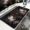 A black gaming mouse pad featuring artwork of characters from The Coffin of Andy and Leyley