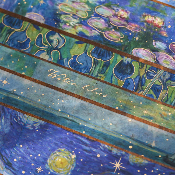 Vintage watercolor washi tape featuring blue water lilies and starry night scenes with gold foil accents