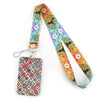 A colorful, patterned fabric lanyard with a decorative tag attached.
