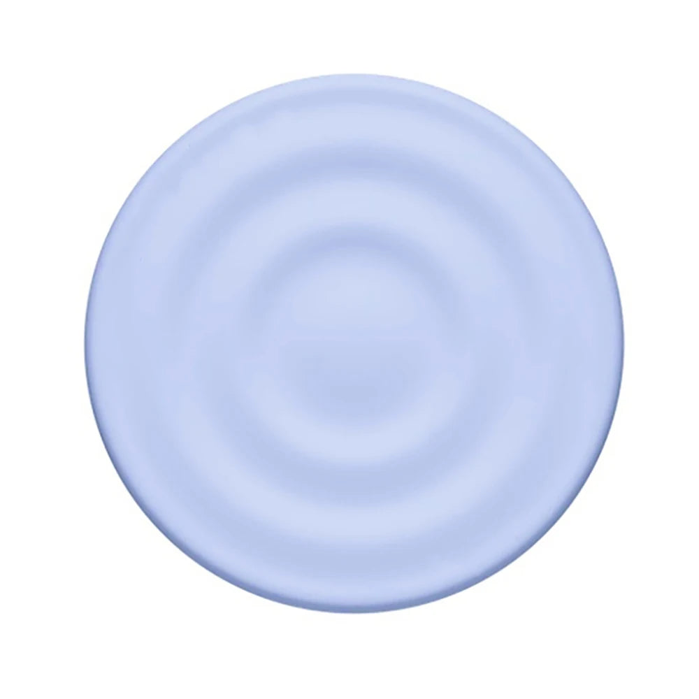 A light blue, circular silicone ripple grip magnetic phone stand.