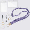 Purple stretchy breakaway ID badge lanyard with a gold-colored retractable reel and various accessories