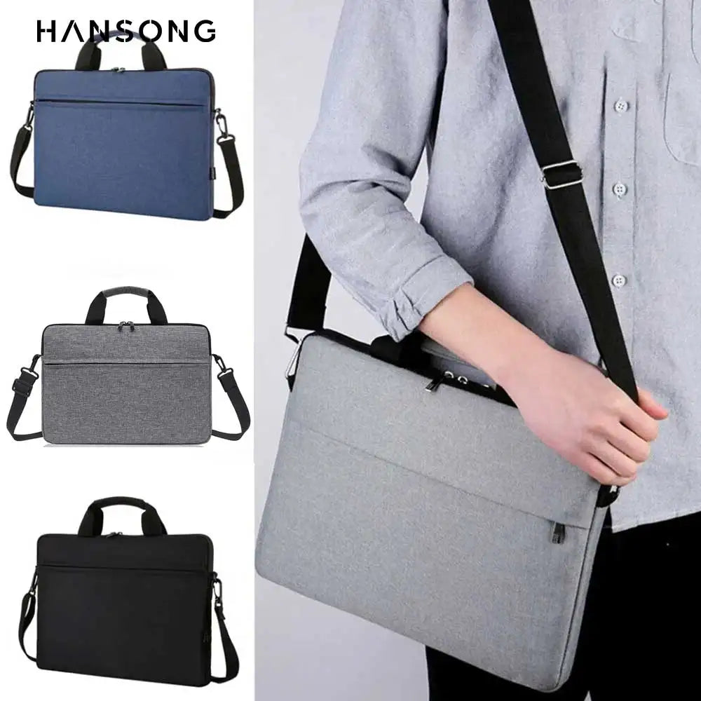 A person is carrying a gray nylon laptop tote bag with black straps over their shoulder.