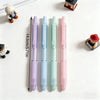 A pack of four pastel gradient gel pens in various shades of purple, blue, and pink are displayed on a white surface.