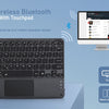 A black backlit wireless Bluetooth keyboard with a touchpad is shown alongside a laptop and smartphone.