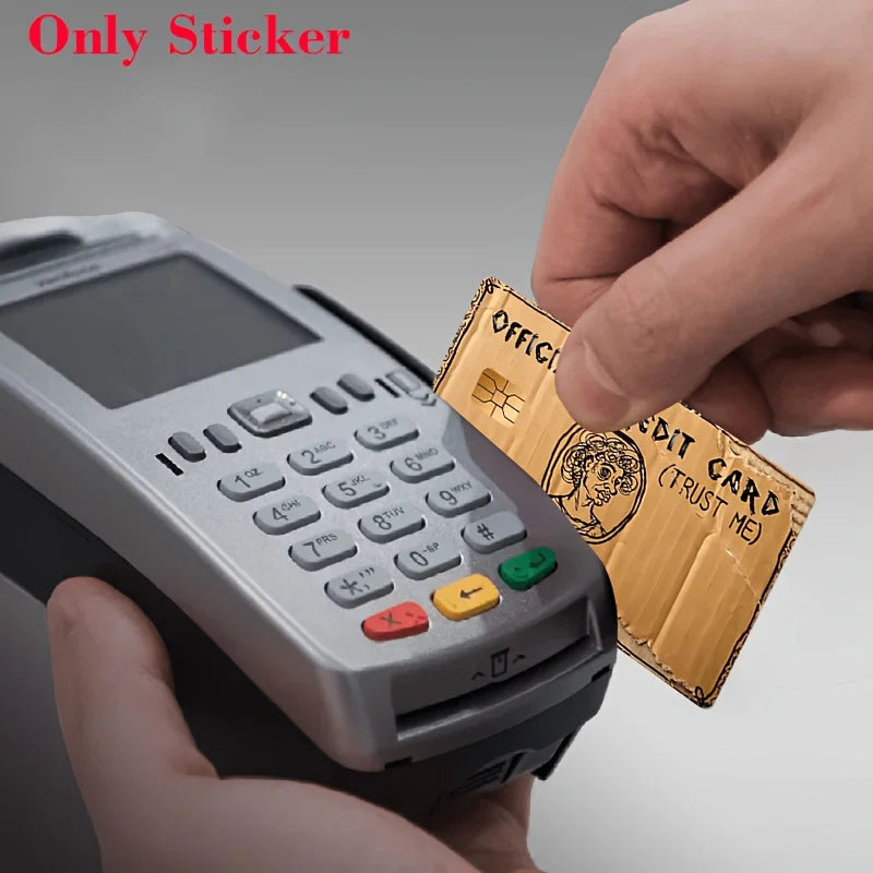 A hand holds a silver electronic device while another finger places an official-looking credit card sticker on the screen.