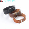 A close-up view of a brown PU leather watch strap with silver buckle details.