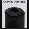 Black non-slip mouse pad rolled up, emphasizing its comfy and durable features.