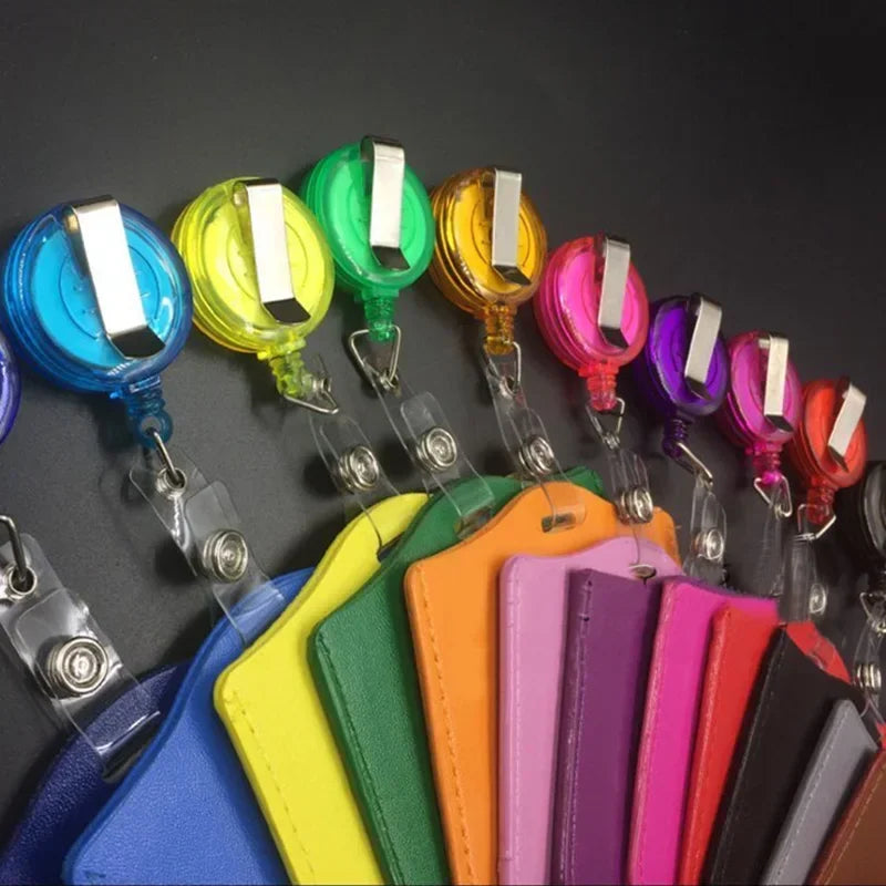 A collection of colorful PU leather retractable ID card holders in various shades including blue, yellow, green, orange, pink