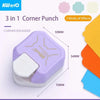 A purple and white 3 in 1 Corner Punch crafting tool with various colored plastic pieces shown next to it.