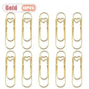 Ten gold metal pen clips designed for holding notebooks and journals