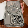 A clear glitter diamond magnetic wireless phone case is held in a hand against a wooden background.