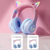 Pink gradient cat ear Bluetooth headphones with light effects shown on a white surface.