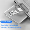 A silver laptop is shown with a foldable adjustable holder attached, demonstrating convenience for use.