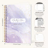 A purple marble A5 monthly planner for 2026–2028 with gold spiral binding and reference calendars.