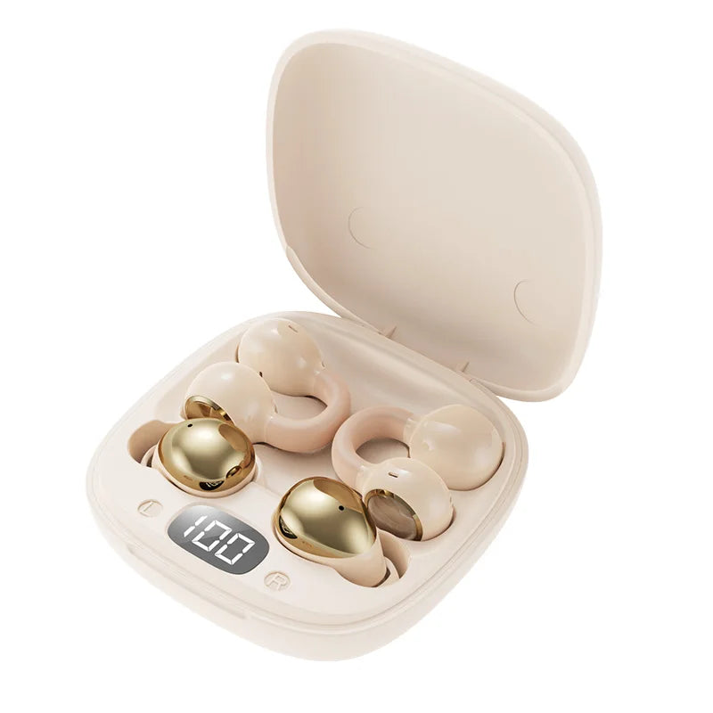 A beige charging case for wireless clip-on earbuds with gold accents.