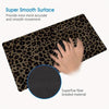 A dark brown leopard print mouse pad with a black textured grip surface.