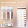 A set of nine colored Quill-type drawing notebook pens from the Maillard series with a grid layout for writing and drawing