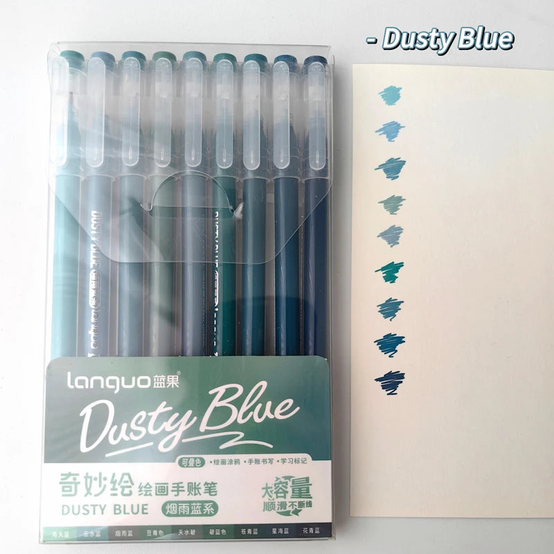 A set of nine Dusty Blue gel pens in a clear plastic case and accompanying notebook.