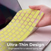 A hand holds a yellow keyboard cover designed for a MacBook Pro, highlighting an ultra-thin design.