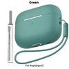 A green liquid silicone case for AirPods Pro 2 shown with a cleaning pen and lanyard.