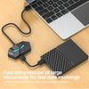 A black USB hub connects a laptop to a hard drive for fast data transmission.
