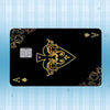 A black card featuring a gold foil design and an embossed square, set against a light blue striped background.