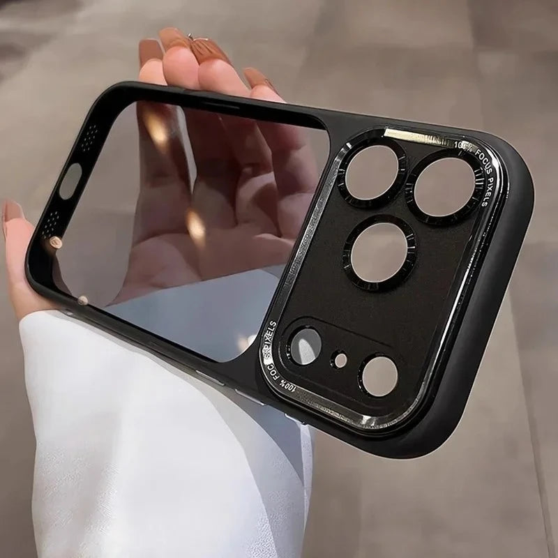 A hand holds a clear shockproof case with camera lens protection for an iPhone, showing multiple camera openings.