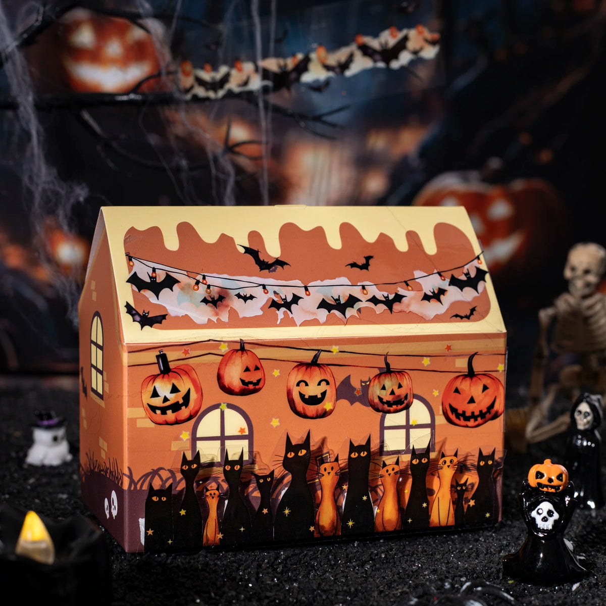 A box of vintage gothic Halloween masking tape featuring bats and jack-o'-lanterns for crafting.