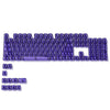 A collection of purple crystal clear RGB keycaps for mechanical keyboards.