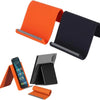 A set of orange and black flexible silicone phone stands shown in various angles.