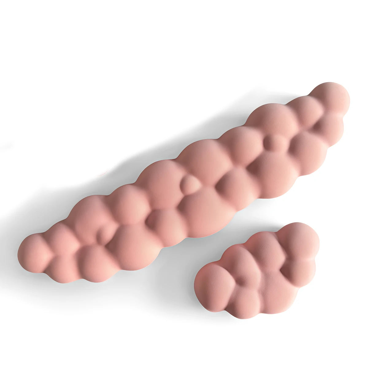 A pink ergonomic memory foam wrist rest pad for desk and mouse, shown in profile.