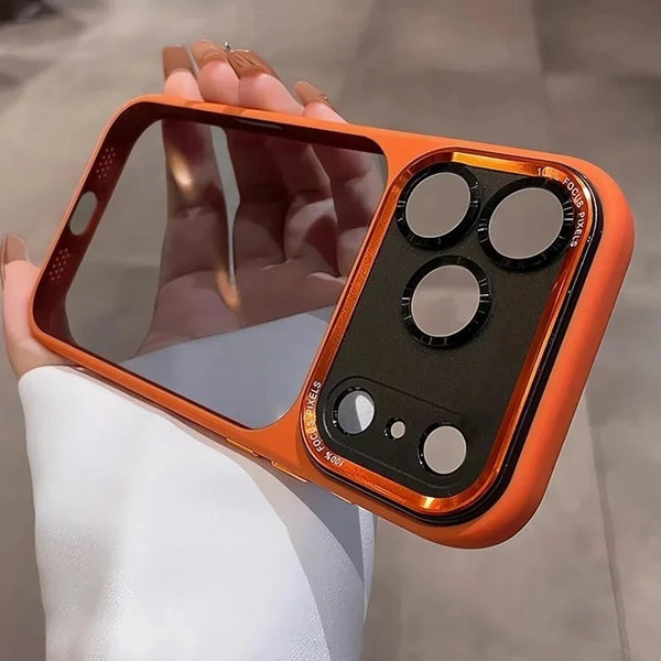 An orange clear shockproof case with multiple camera lenses protecting an iPhone is held in a hand.