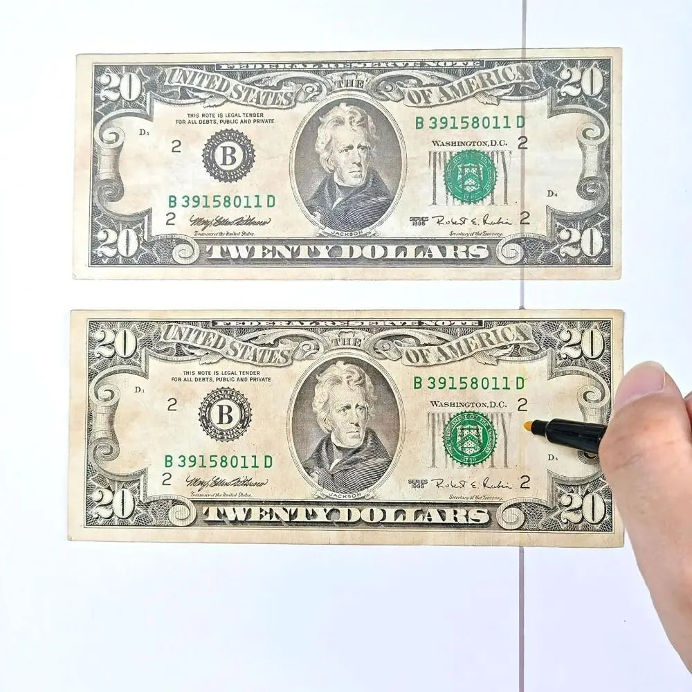 Two United States twenty dollar bills side by side for counterfeit detection