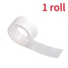 A roll of clear double-sided adhesive dots for crafts and DIY projects.